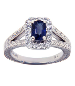Custom sapphire engagement ring surrounded by diamonds