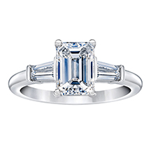 Emerald cut engagement ring with two baguette diamonds on the sides