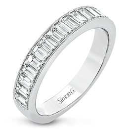 White gold anniversary band with baguette cut diamonds channel set halfway around