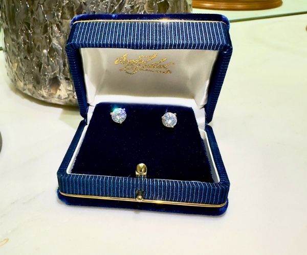 diamond stud earrings in box from roman jewelers