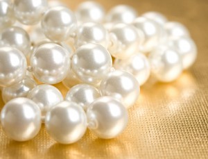 Close up photo of loose white pearls