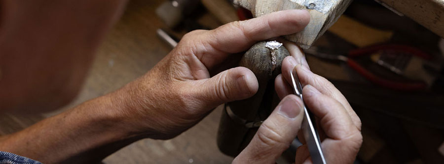 Jeweler working on a ring in our repair shop