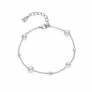 Mikimoto 18K White Gold Bracelet with 2 Round Akoya Pearls A+ 5.5mm & 2 Round Akoya Pearls A+ 6.5mm & 3 Round Diamonds 0.15 Tcw F-G VS  Size 7